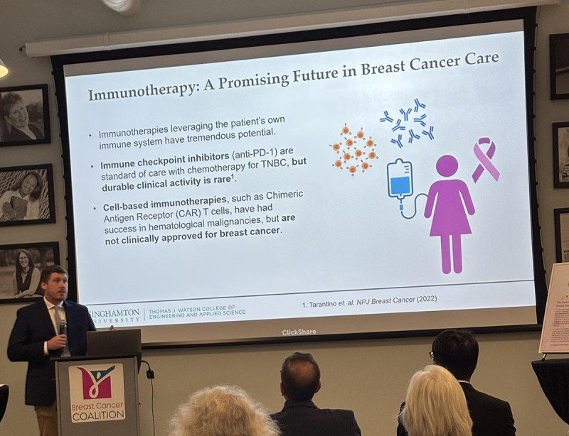 Assistant Professor Daniel S. Reynolds presents his research to the Breast Cancer Coalition in Rochester earlier this month.