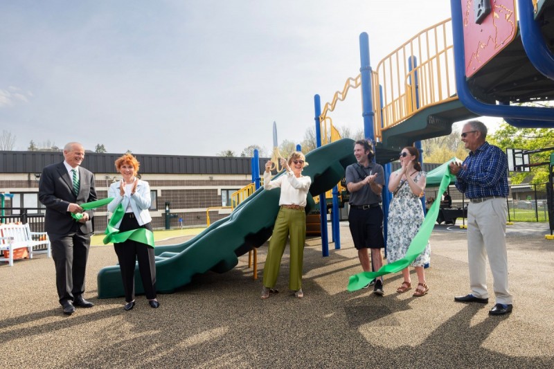 From left: Binghamton University President Harvey Stenger; Broome County Legislator and Binghamton University Foundation board member Kim Myers; Nancy Heichemer; Daniel Myers and his fiancée, Anne Glasgow; and Rick Heichemer cut the ribbon April 29 at the enhanced Social Learning Center at Binghamton University.