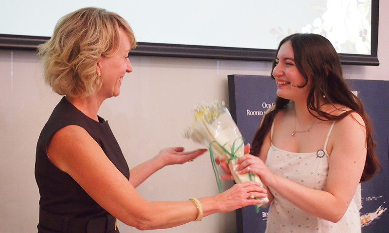 Clinical Associate Professor Tina Caswell congratulates graduate Alessandra Antonacci during a pinning ceremony for the first cohort of Decker's MS-SLP program.