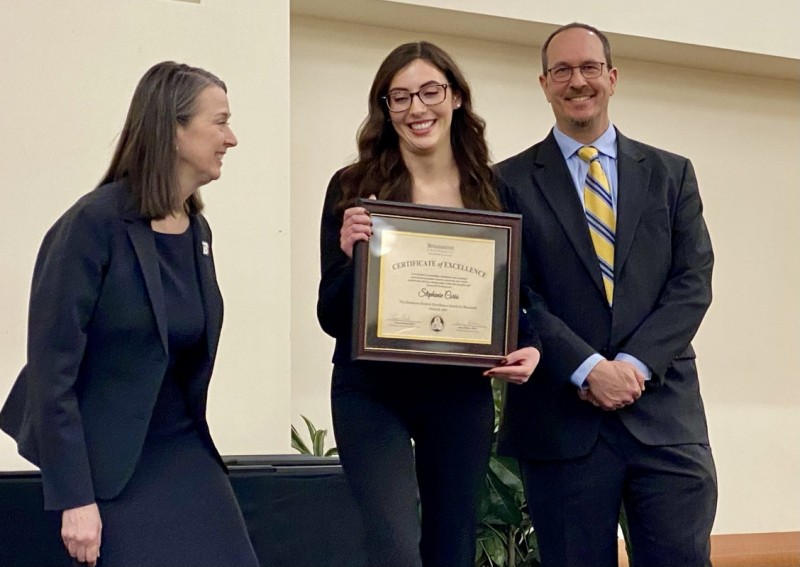 Stephanie Corio, a doctoral student in chemistry, receives the Award for Excellence in Research from Binghamton University President Anne D'Alleva and Dean of the Graduate School Terrence Deak.
