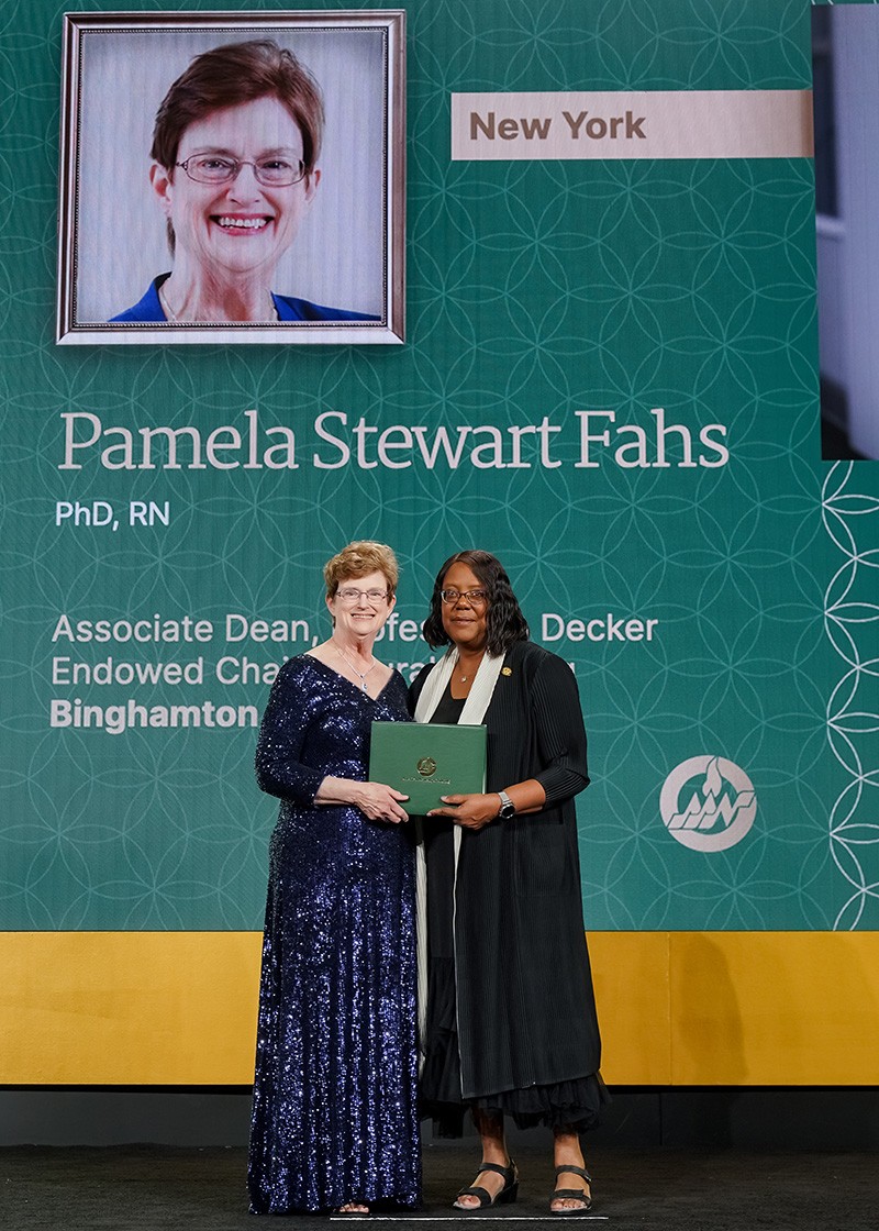 Pamela Stewart Fahs (left) was inducted into the American Academy of Nursing (AAN) in 2022 at the academy's annual conference. Presenting the award is Linda D. Scott, president elect, AAN.