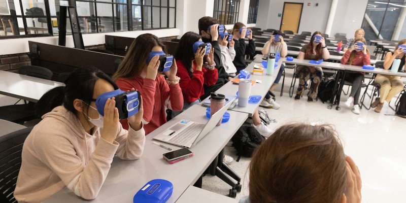 Nursing students in the Baccalaureate Accelerated Track program wear virtual reality goggles to help learn about empathy.