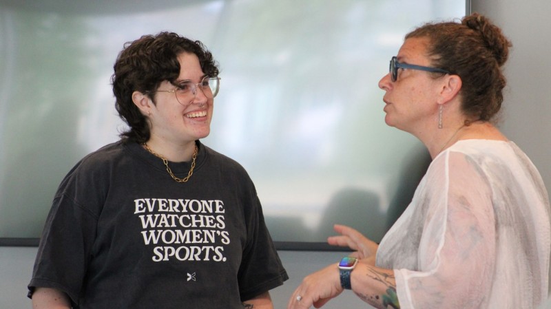 Christianna Friedrichsen (left), the associate director of admissions, speaks with Tracy Brooks (right), the chair and associate professor of pharmaceutical sciences, during the wellness workshop.