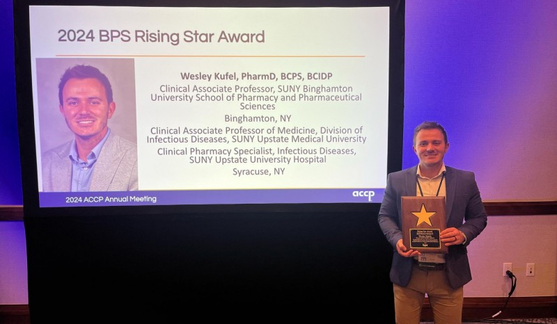 Binghamton Clinical Associate Professor Wes Kufel with his 2024 Board of Pharmacy Specialties Rising Star Award.