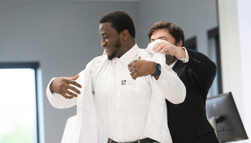 Mubarak Adams is the first physical therapy student at Binghamton University to receive a white coat.