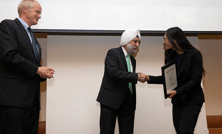 President Harvey Stenger, left, and School of Management Dean Upinder Dhillon, middle, present the 2018 SOM Senior of the Year award to Wu at the SOM Spotlight event in Sept. 2018.
