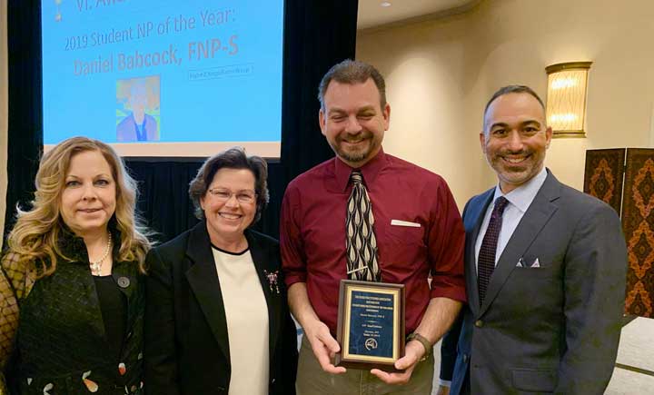 Decker alumnus Daniel Babcock, holding award, was selected as the 2019 Student Nurse Practitioner of the Year for Region 2 of the Nurse Practitioner Association of New York State. He is shown, from left, with NPA President Michelle Applebaum, Decker Clinical Associate Professor Frances Munroe and Executive Director of the NPA Stephen Ferraara.