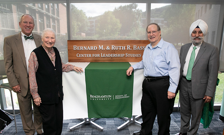 Provost Don Nieman, Ruth Bass, Robert Bass and School of Management Dean Upinder Dhillon (left to right) unveil the sign for the newly named Bernard M. and Ruth R. Bass Center for Leadership Studies on Sept. 14, 2018.