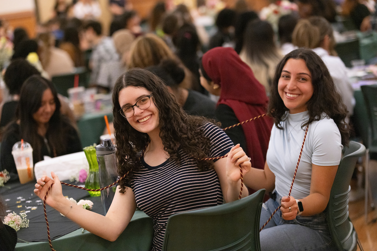 First-generation students Yael Bruk (left) and Nora Monasheri at the third annual BFirst Cording ceremony.