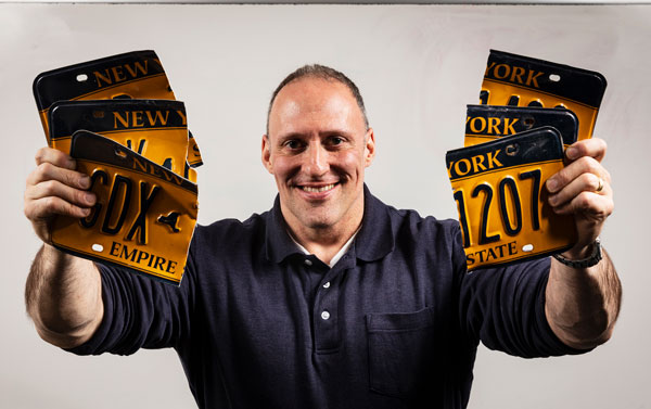 Bill Clark, an adjunct lecturer in the Health and Wellness Studies Department of the Decker School of Nursing, beat the Guinness World Record for tearing license plates.