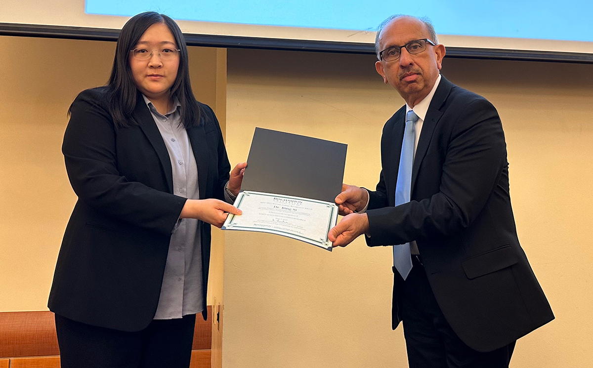 Assistant Professor Bing Si won a Watson College Recognition Award for Early Stage Distinguished Research at the spring luncheon in May. In this photo, she is accepting the award from Watson College Dean Hari Srihari.