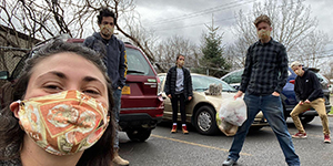 Eliana Epstein, director of Binghamton Food Rescue, with other student volunteers who are social distancing while assisting those suffering from food insecurity.