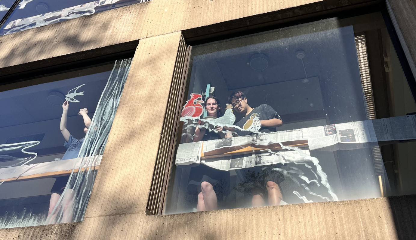 Binghamton University’s chapter of the Audubon Society paints a bird-themed mural on the Science Library's windows to prevent bird strikes.