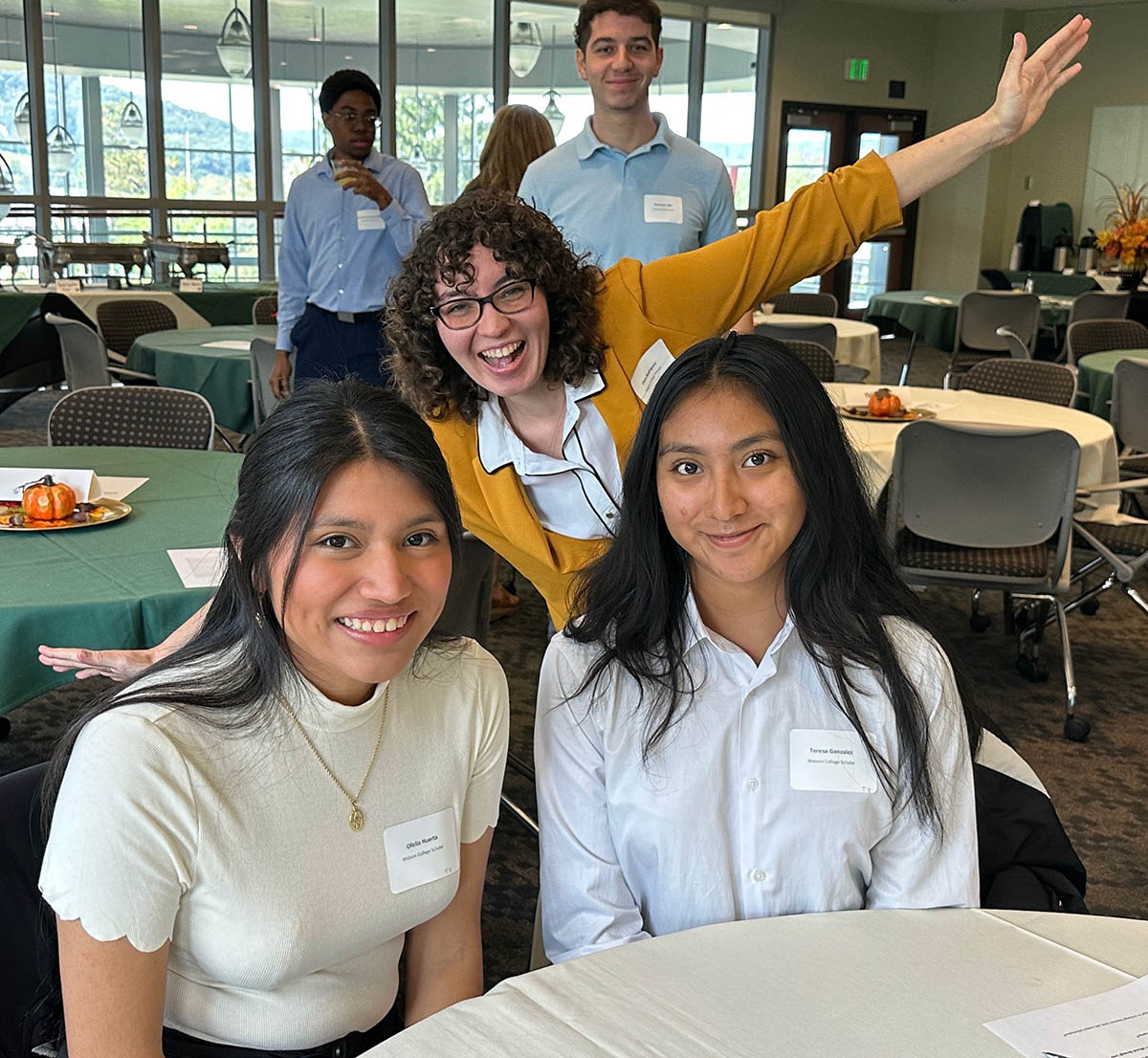 Clara Rodriguez '24 goofs around with fellow Watson College Scholars Ofelia Huerta, left, and Teresa Gonzalez at the fall 2023 welcome luncheon for the program.