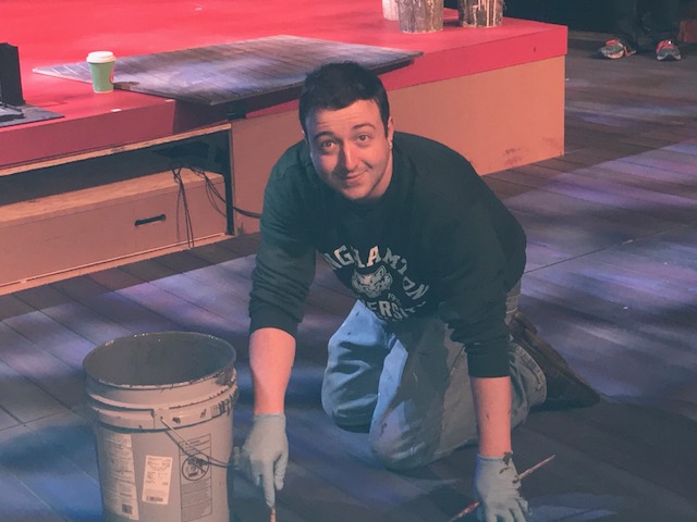 Clarence Hause paints the stage at Stages Repertory Theatre in Houston, Texas.