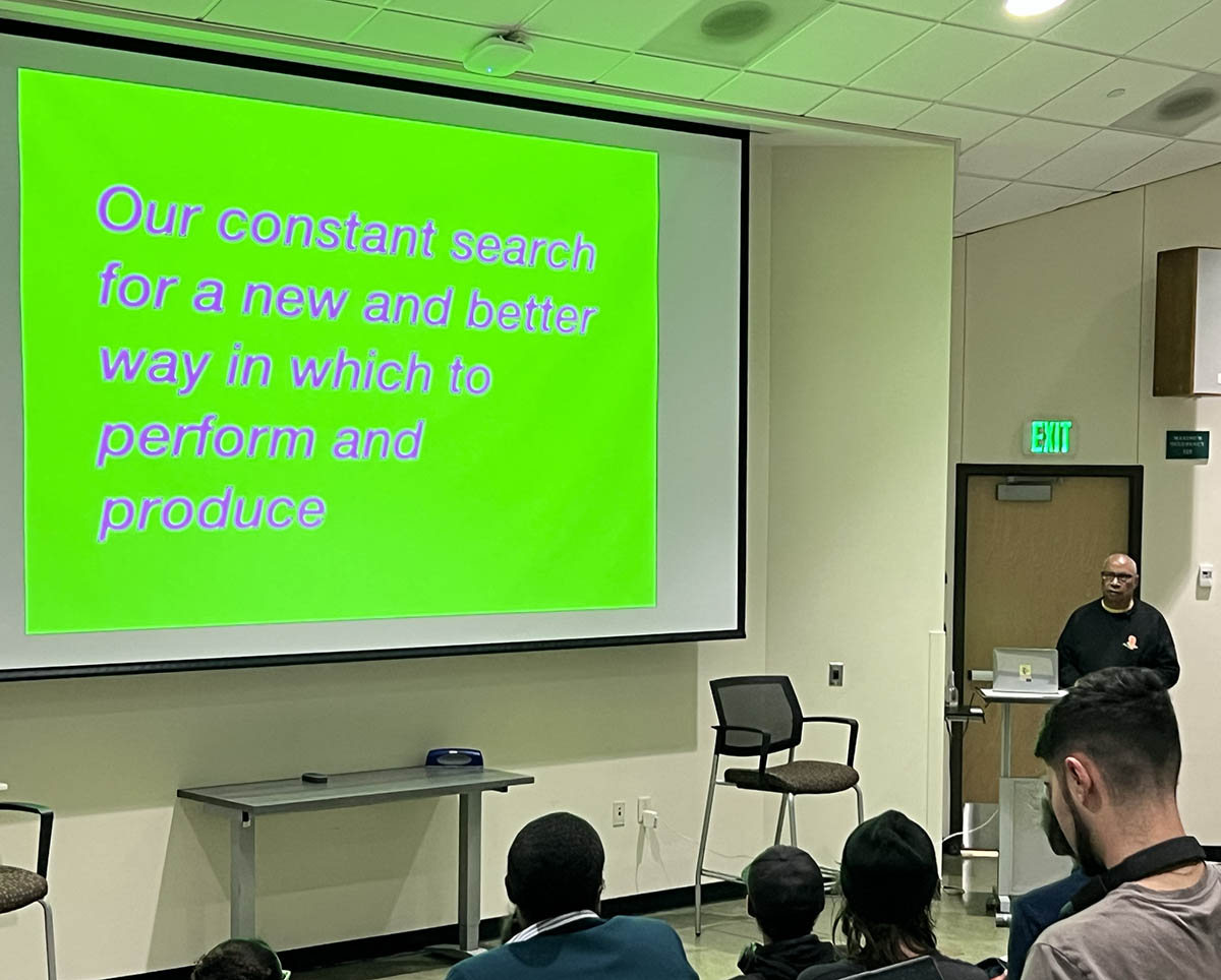 Tony Cokes speaks to Binghamton University students and faculty as the School of the Arts Inaugural Visiting Artist.