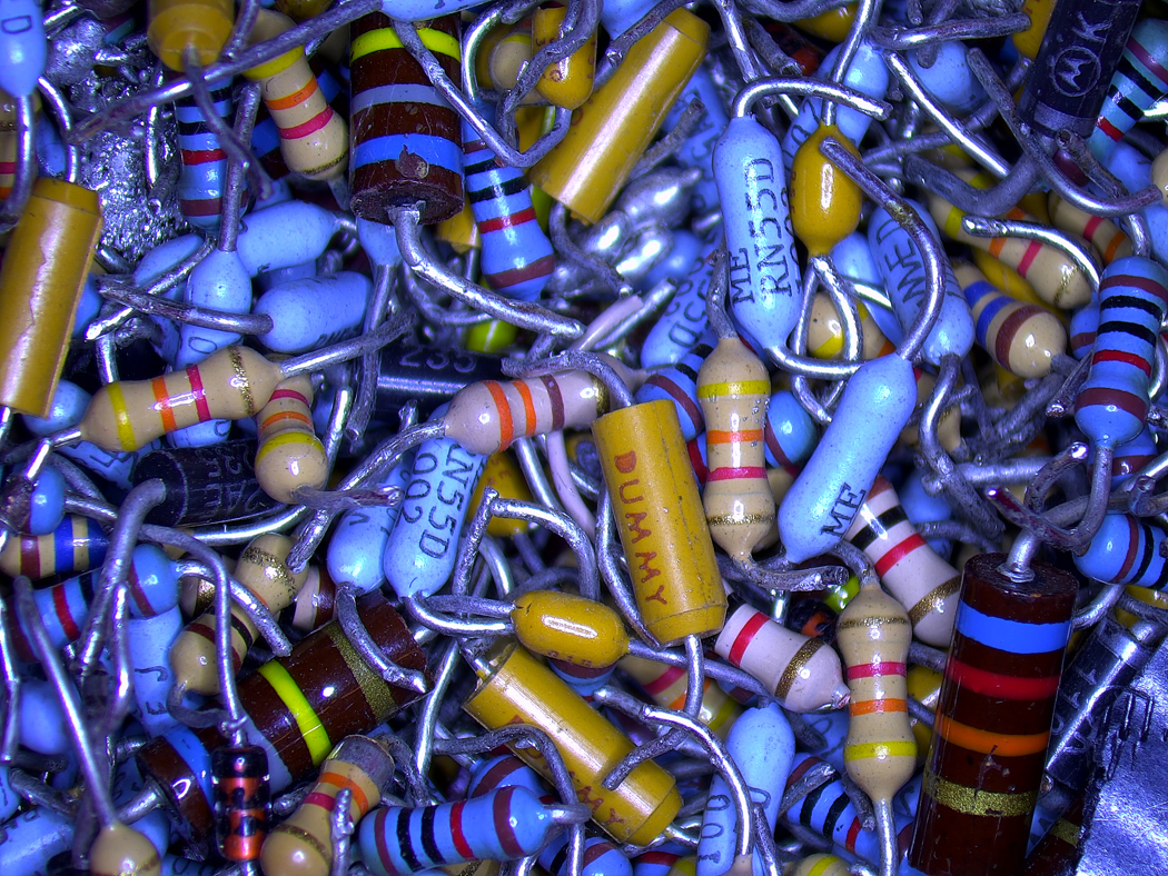 A collection of resistors, solder, and other electronic components that have been cut and removed from circuit boards. Students learning to solder at Watson are supplied with practice boards, which are later cleared of the components.