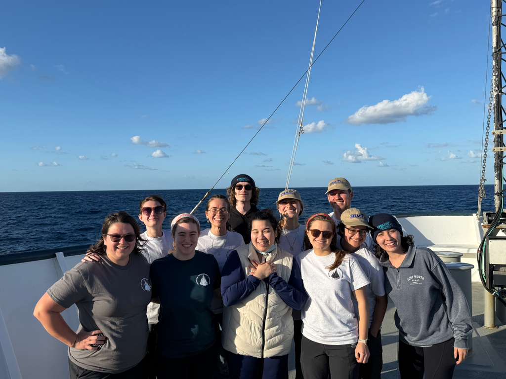 Earth Science doctoral candidate Jeanette deCuba, far right, aboard the RV Atlantis, an oceanographic research ship owned by the U.S. Navy and operated by the Woods Hole Oceanographic Institution.