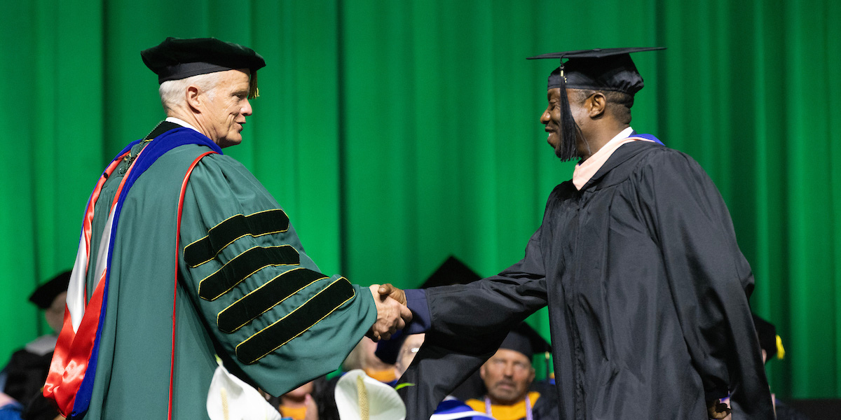 University President Harvey Stenger congratulated each graduating student as they crossed the stage during Decker College's Commencement ceremony on May 15.