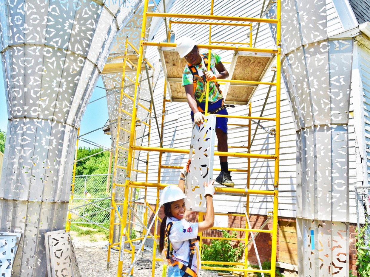 Participants in the Detroit Youth Employment Program work on the American Riad, a public sculpture in Detroit.