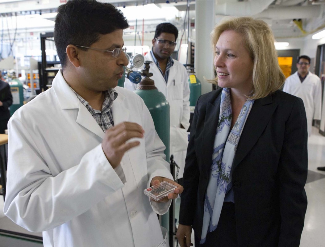 Electrical and computer engineering Assistant Professor Tara P. Dhakal (seen here giving a tour of his lab to Sen. Kirsten E. Gillibrand) has developed a new method to create ultrathin films