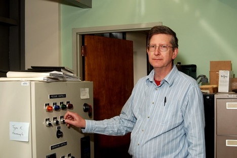 Geological Sciences and Environmental Studies Professor David Jenkins in his lab.