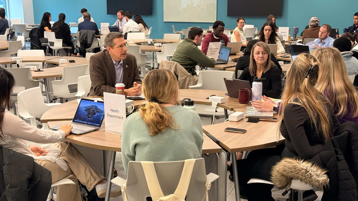 Faculty and students from Binghamton University and Upstate Medical University working together during the Emergency Management Simulation.