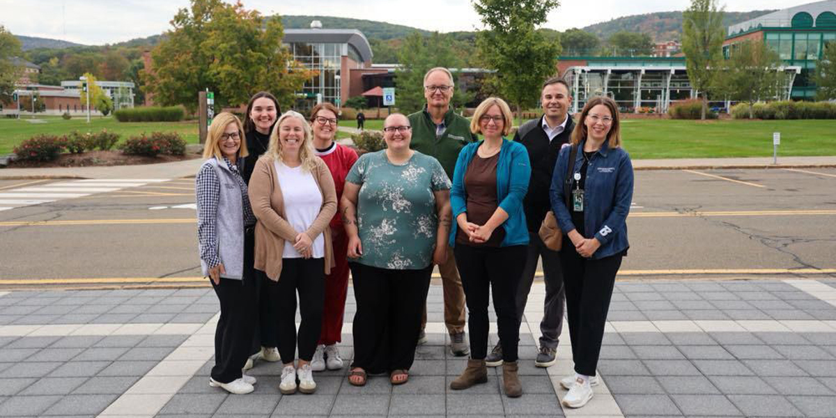A contingent of faculty from the College of Community and Public Affairs, staff from the Center for Civic Engagement and community partners attended the Engagement Scholarship Consortium Annual Conference Oct. 6-9, 2025. Pictured, from left, are Kelli Smith, assistant vice president for student success; Kyra Hickey, community engagement coordinator; Andrea Decker, assistant dean of CCPA; Sara Hall, senior assistant director, Center for Civic Engagement; Renae Barber, community engagement outreach and assessment specialist; Barrett Brenton, faculty engagement associate; Kelley L Cook, assistant professor, Department of Social Work; Larry Dake, superintendent of Chenango Valley Central School District; and Alison Handy Twang, director of the Center for Civic Engagement.