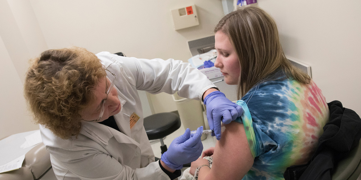 A student receives a flue vaccine at Decker Student Health Services Center.