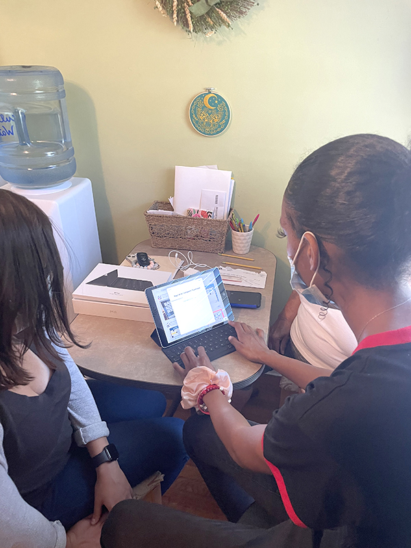 George manages setup and customization of one of the iPads used in the social isolation study.