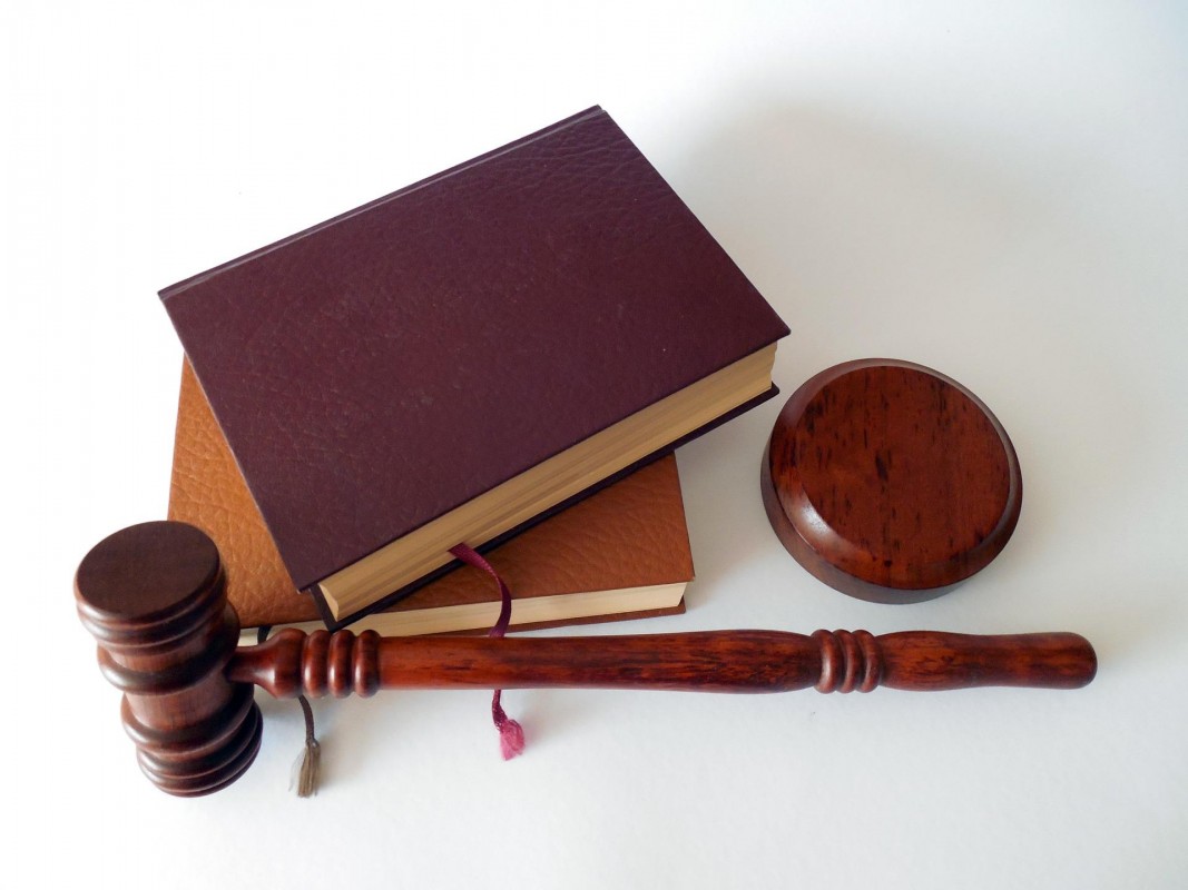 Stock image depicting a gavel and law books.