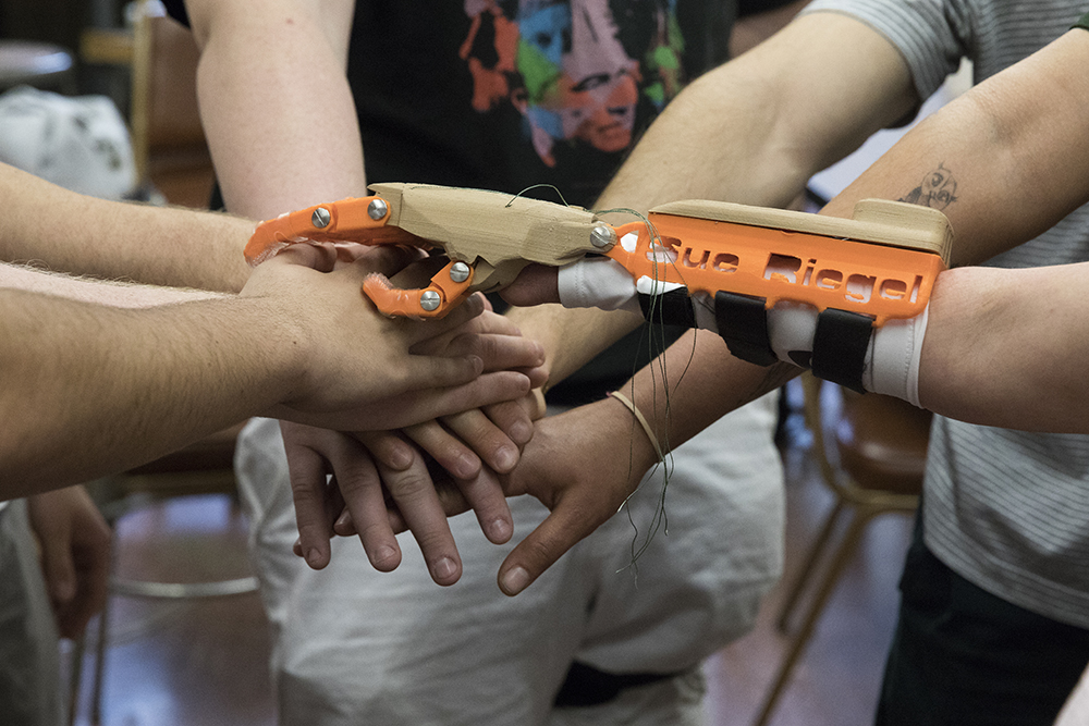 Engineering students develop 3-D-printed prosthetic hand for campus  employee