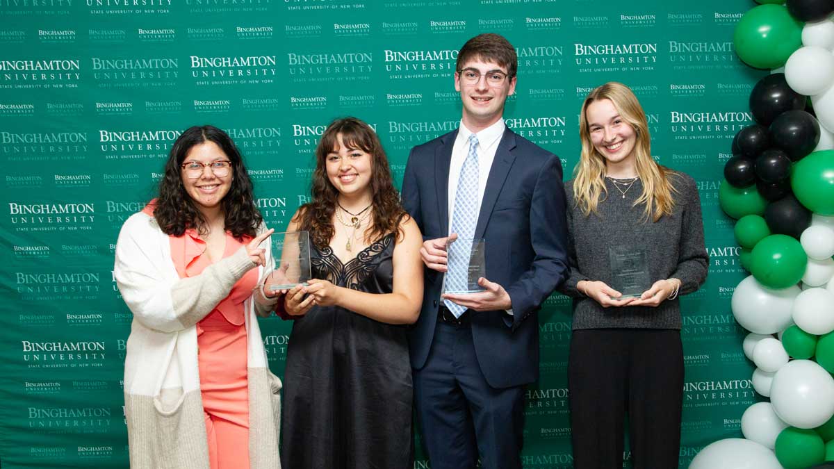 Trevor Fornara (second from right), president and editor in chief of Binghamton University’s non-partisan Happy Medium student publication, accepted three awards throughout the evening: Excellence in Community Engagement (student organization), Student Organization President of the Year and Outstanding Organization of the Year.
