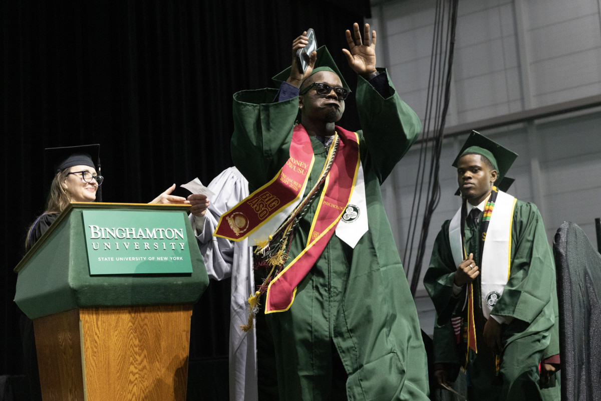 A student celebrates his degree during Harpur College's morning Commencement ceremony on May 16, 2026.