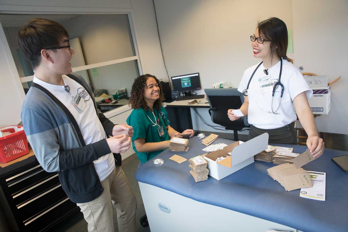Decker School of Nursing students (from left) Jae Moon Chung, Diana Carter and Vivian Lee at the Healthy Practices Clinic open house.
