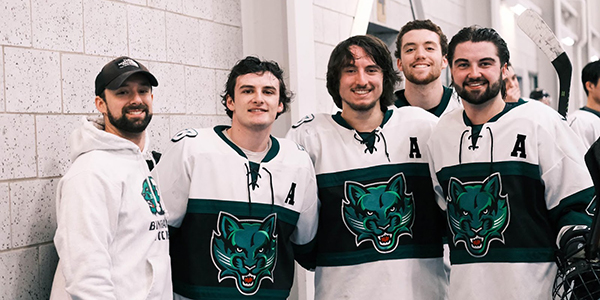 Members of the Binghamton University Club Hockey team celebrate their second-place finish in the Collegiate Hockey Federation Cup. Left to right: Tom Relyea, Nicholas Galanti, Max Klares and Jack O’Bryan.