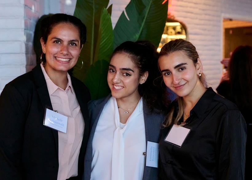 Michelle Schoenwald (left), now a senior philosophy, politics and law (PPL) major, interned with the law firm Schlam Stone & Dolan in New York City. Here, she appears with colleagues at an office event.