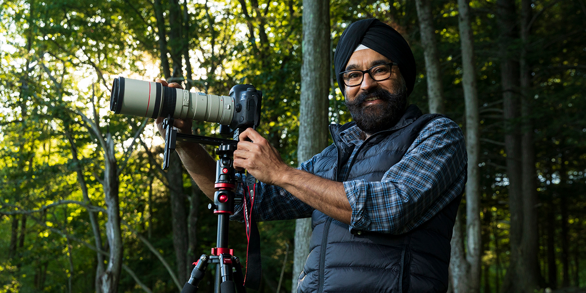 Surinder Kahai takes photos in Binghamton University's Nature Preserve