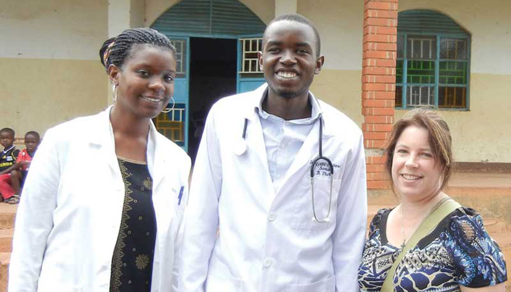 Professor of Pharmacy Practice KarenBeth Bohan, right, with pharmacy students at the Blood Pressure Clinic in Masindi, Uganda.