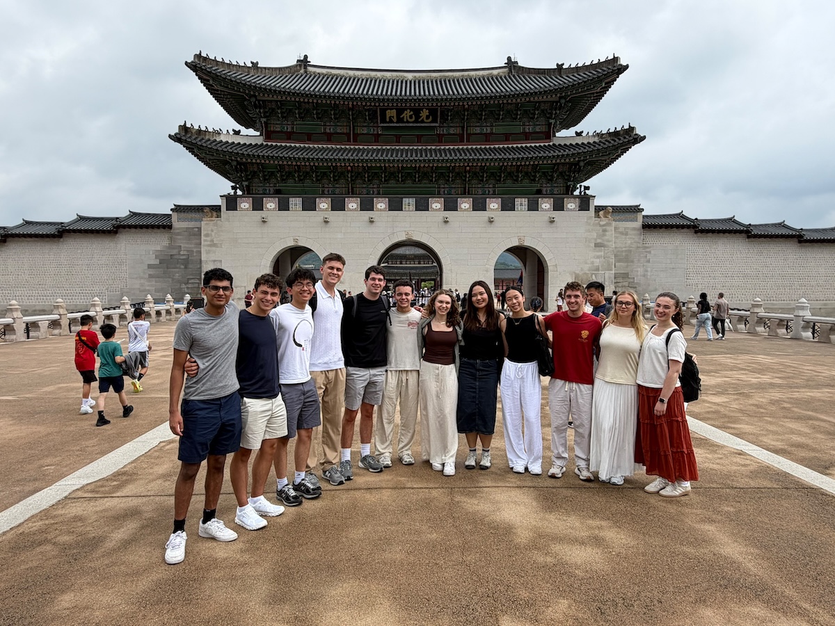 Twelve SOM students pose for a photo during their summer trip to Seoul.
