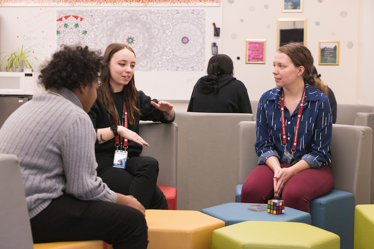 Mackenzie St. John (center) at her Johnson City High School BUCS internship.