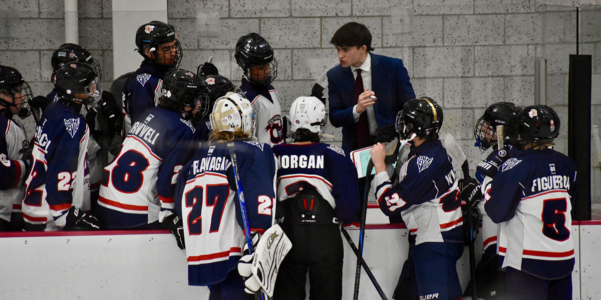 Maksim Kagan, a business administration student in the Binghamton University School of Management, coaches the Chenango Forks High School Varsity Hockey team. At Binghamton, he's building the skills to pursue his dream career working in the business behind professional hockey.