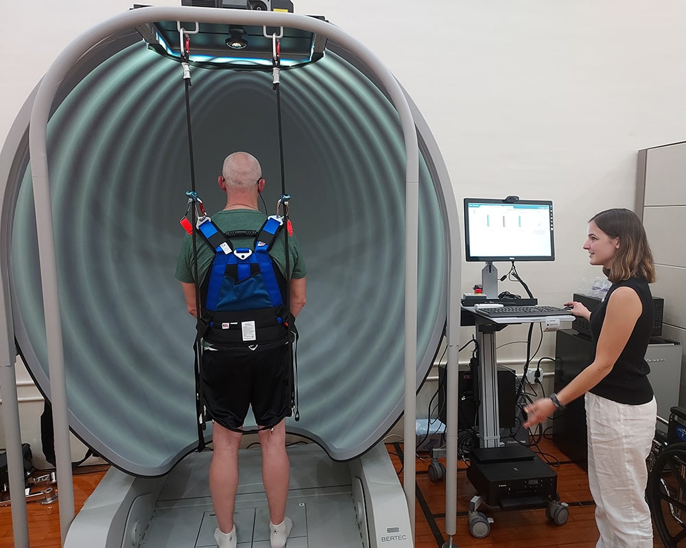 The Bertec Computerized Dynamic Posturography system in Binghamton University's Motion Analysis Research Laboratory features immersive virtual reality environments within a dome.