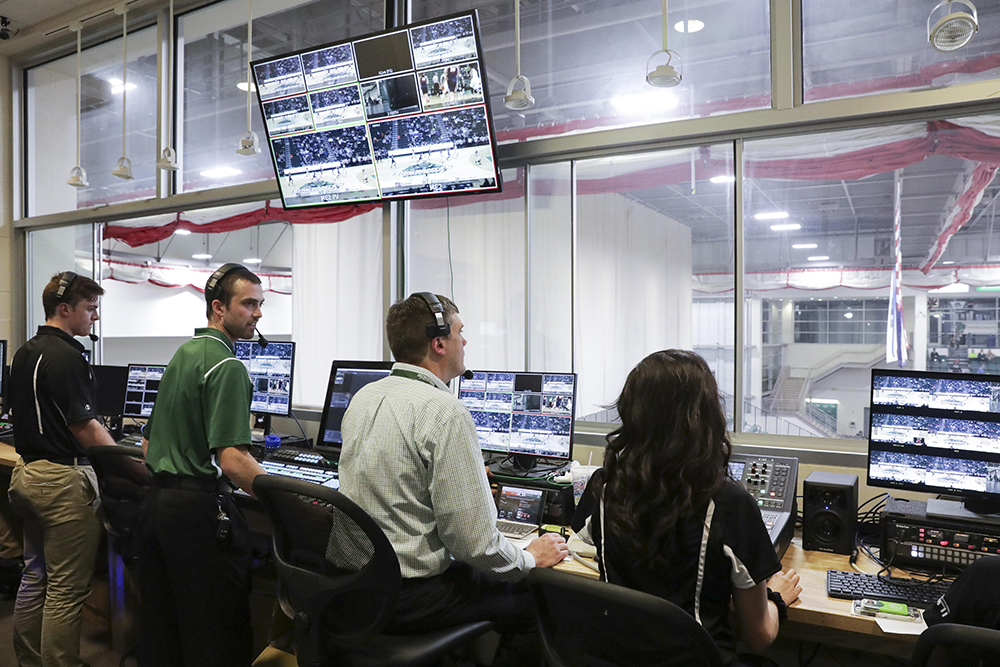 Members of the Binghamton University basketball broadcast team work a game early in the season. Many members of the crew are actually students.