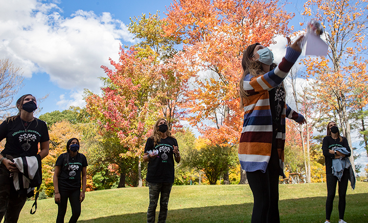 The Mindset Mentors brightened the day for students in COVID isolation by chatting with them from a safe distance. They also threw bags of candy to them.