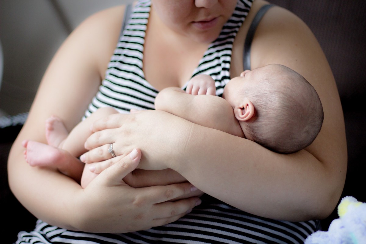 An image of a mother holding a baby