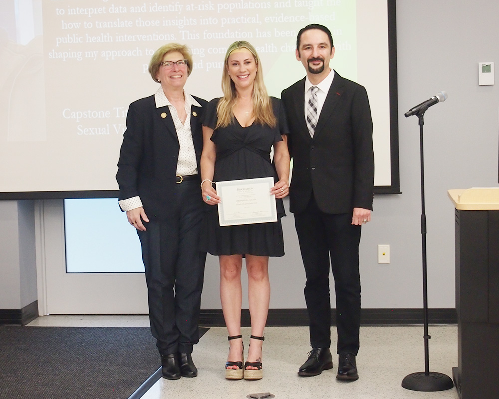 Associate Professor and Founding Director Yvonne Johnston '93, MS '97; MPH student Meredith Smith '11; and Decker College Dean Mario Ortiz at the Master of Public Health Class of 2025 Recognition Ceremony, where Smith received the Public Health Leadership Award.
