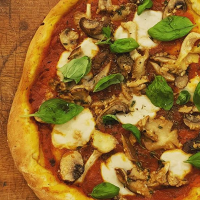 Parlor City Vegan's homemade pizza with fresh mozzarella