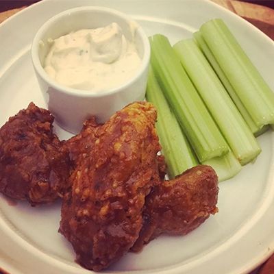 Parlor City Vegan's root beer BBQ wings with blue cheese and celery