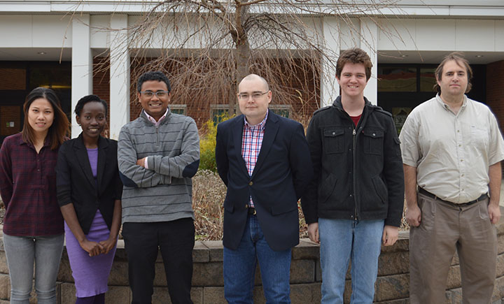 Computer science assistant professor Aravind Prakash, third from the left, with a group of students currently working in his lab.
